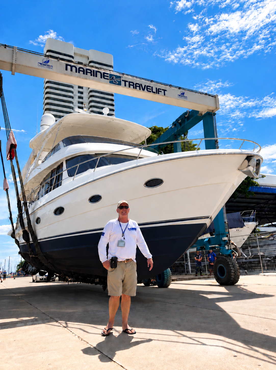John Stubbs standing in front of a yacht at Ocean Marina Pattaya.